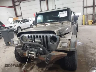 2005 Jeep Wrangler Rubicon with VIN 1J4FA69S65P311732, listed as a IAAI auction lot 41442147 with 174,277 mi miles. Bid and sale history available at carsss.com. Image 12.