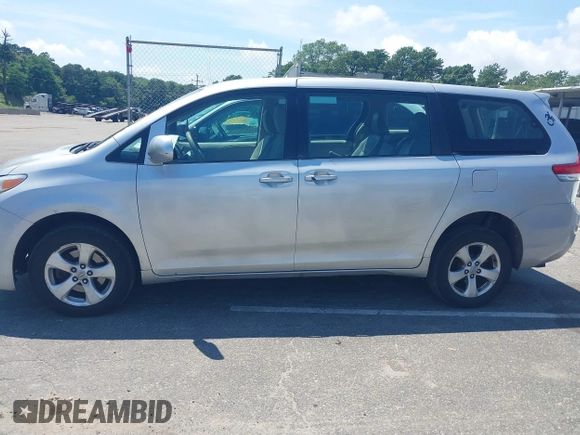 2014 Toyota Sienna L with VIN 5TDZK3DC9ES518653, listed as a IAAI auction lot 42767591 with 261,730 mi miles and . Bid and sale history available at DreamBid. Image 14.