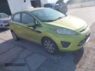 2012 Ford Fiesta SE z VIN 3FADP4EJ7CM115319, wystawiony jako IAAI lot #42350368 z przebiegiem 175 423 mil mil oraz . Historia ofert i sprzedaży dostępna na DreamBid. Obrazek 1.