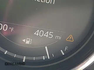 2021 Mazda MX-5 Miata Grand Touring z VIN JM1NDAM71M0457011, wystawiony jako IAAI lot #42427652 z przebiegiem 4 045 mil mil oraz . Historia ofert i sprzedaży dostępna na DreamBid. Obrazek 16.
