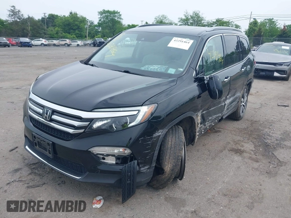 2017 Honda Pilot Touring with VIN 5FNYF6H90HB052474, listed as a IAAI auction lot 42291464 with 103,288 mi miles and . Bid and sale history available at DreamBid. Image 2.