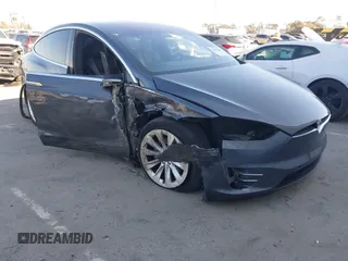 2018 Tesla Model X 75D with VIN 5YJXCDE28JF142509, listed as a IAAI auction lot 41993444 with 100,244 mi miles and . Bid and sale history available at carsss.com. Image 1.