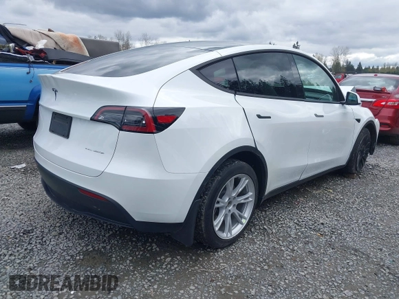 2023 Tesla Model Y Long Range z VIN 7SAYGAEEXPF647352, wystawiony jako IAAI lot #41955933 z przebiegiem Nie podano mil oraz . Historia ofert i sprzedaży dostępna na DreamBid. Obrazek 4.