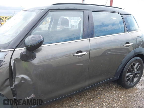 2011 MINI Countryman S with VIN WMWZC5C53BWM11022, listed as a IAAI auction lot 42249403 with 173,718 mi miles and . Bid and sale history available at DreamBid. Image 14.