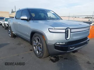 2024 Rivian R1T Adventure with VIN 7FCTGBAAXRN032590, listed as a IAAI auction lot 41013387 with 4,892 mi miles. Bid and sale history available at carsss.com. Image 1.