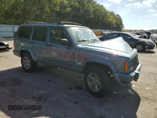 1998 Jeep Cherokee Sport with VIN 1J4FT68S4WL121559, listed as a Copart auction lot 77387794 with 163,453 mi miles and Salvage Title. Bid and sale history available at carsss.com. Image 4.