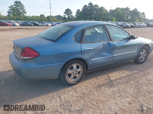 2006 Ford Taurus SE with VIN 1FAFP53U26A179541, listed as a IAAI auction lot 42000612 with 214,881 mi miles. Bid and sale history available at carsss.com. Image 4.