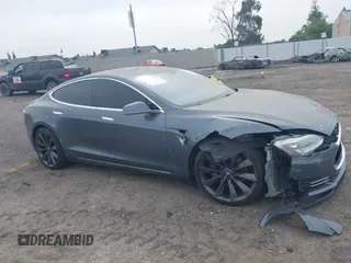 2013 Tesla Model S with VIN 5YJSA1AG5DFP13149, listed as a IAAI auction lot 42116437 with 140,999 mi miles. Bid and sale history available at carsss.com. Image 14.