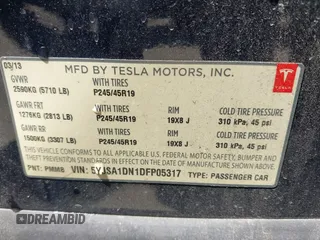 2013 Tesla Model S with VIN 5YJSA1DN1DFP05317, listed as a IAAI auction lot 42086998 with 150,964 mi miles. Bid and sale history available at carsss.com. Image 9.