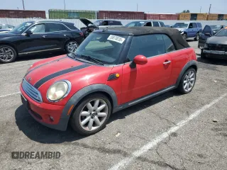 2010 MINI Convertible with VIN WMWMR3C59ATU97966, listed as a Copart auction lot 59870035 with 124,132 mi miles and Salvage title. Bid and sale history available at DreamBid. Image 1.