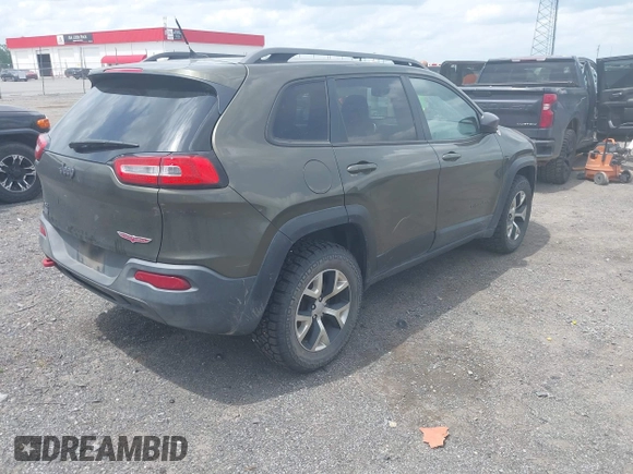 2014 Jeep Cherokee Trailhawk z VIN 1C4PJMBBXEW232210, wystawiony jako IAAI lot #42143917 z przebiegiem 113 603 mil mil oraz . Historia ofert i sprzedaży dostępna na DreamBid. Obrazek 4.
