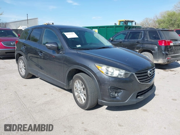 2016 Mazda CX-5 Touring z VIN JM3KE2CY4G0708972, wystawiony jako IAAI lot #42043013 z przebiegiem 157 573 mil mil oraz . Historia ofert i sprzedaży dostępna na DreamBid. Obrazek 1.