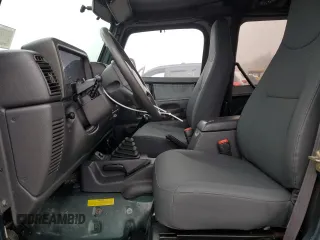 1999 Jeep Wrangler Sport z VIN 1J4FY19SXXP427968, wystawiony jako Copart lot #50102855 z przebiegiem 174 381 mil mil oraz Czysty tytuł • Clean title. Historia ofert i sprzedaży dostępna na DreamBid. Obrazek 7.