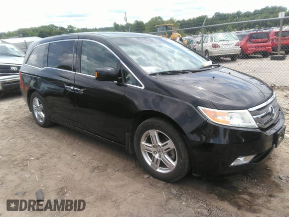 2012 Honda Odyssey Touring with VIN 5FNRL5H97CB066596, listed as a IAAI auction lot 42472935 with 217,182 mi miles and . Bid and sale history available at DreamBid. Image 1.