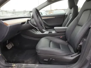 2023 Tesla Model 3 with VIN 5YJ3E1EA3PF697049, listed as a Copart auction lot 55601295 with 12,373 mi miles and Salvage Title. Bid and sale history available at DreamBid. Image 7.
