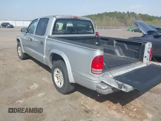2003 Dodge Dakota SLT with VIN 1D7HL48N83S236590, listed as a IAAI auction lot 41796103 with 221,667 mi miles. Bid and sale history available at carsss.com. Image 3.