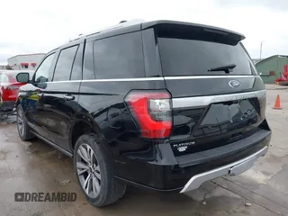 2019 Ford Expedition Platinum with VIN 1FMJU1MT8KEA02325, listed as a IAAI auction lot 41861772 with 77,124 mi miles. Bid and sale history available at carsss.com. Image 3.