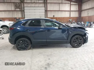 2024 Mazda CX-30 S Select Sport z VIN 3MVDMBBM2RM707143, wystawiony jako IAAI lot #42267284 z przebiegiem 6 133 mil mil oraz . Historia ofert i sprzedaży dostępna na DreamBid. Obrazek 13.