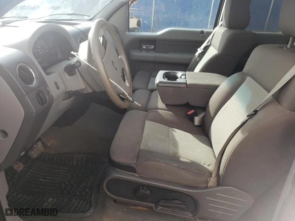 2005 Ford F-150 STX with VIN 1FTRX04W75KC31023, listed as a Copart auction lot 77093034 with 266,966 mi miles and Salvage Title. Bid and sale history available at carsss.com. Image 7.