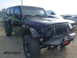 2020 Jeep Wrangler Unlimited Rubicon with VIN 1C4HJXFG1LW141335, listed as a IAAI auction lot 42724973 with 59,843 mi miles and . Bid and sale history available at DreamBid. Image 1.