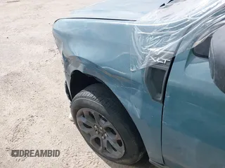 2022 Ford Maverick XL z VIN 3FTTW8E91NRA83544, wystawiony jako IAAI lot #41516295 z przebiegiem Nie podano mil oraz . Historia ofert i sprzedaży dostępna na DreamBid. Obrazek 6.