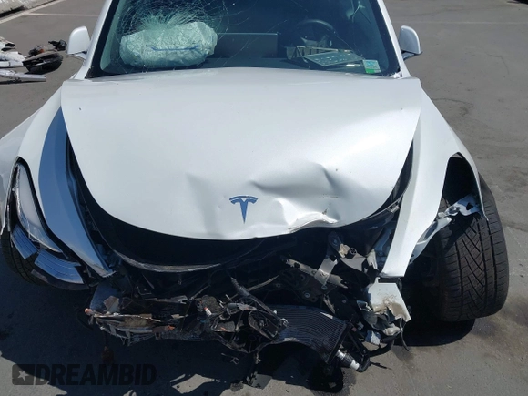2020 Tesla Model 3 Standard Range Plus with VIN 5YJ3E1EAXLF590591, listed as a IAAI auction lot 42140338 with 79,342 mi miles and . Bid and sale history available at DreamBid. Image 10.