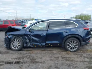 2021 Mazda CX-9 Grand Touring with VIN JM3TCBDY3M0537975, listed as a IAAI auction lot 42251894 with 50,156 mi miles and . Bid and sale history available at DreamBid. Image 14.