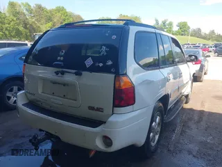 2003 GMC Envoy SLT with VIN 1GKDT13S432190085, listed as a IAAI auction lot 42106915 with 289,933 mi miles. Bid and sale history available at carsss.com. Image 4.