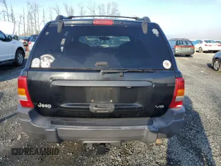 1999 Jeep Grand Cherokee Laredo z VIN 1J4GW58N1XC737706, wystawiony jako Copart lot #83107914 z przebiegiem Nie podano mil oraz Szkoda całkowita • Salvage title. Historia ofert i sprzedaży dostępna na DreamBid. Obrazek 6.