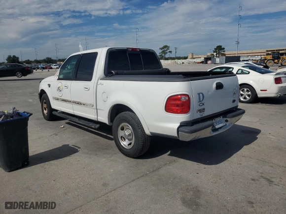 2001 Ford F-150 SuperCrew XLT with VIN 1FTRW07W41KE02772, listed as a Copart auction lot 73586724 with 0 mi miles and Salvage Title. Bid and sale history available at carsss.com. Image 2.