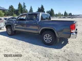2017 Toyota Tacoma SR5 with VIN 3TMCZ5ANXHM052092, listed as a Copart auction lot 64898135 with 95,743 mi miles and Salvage title. Bid and sale history available at DreamBid. Image 2.