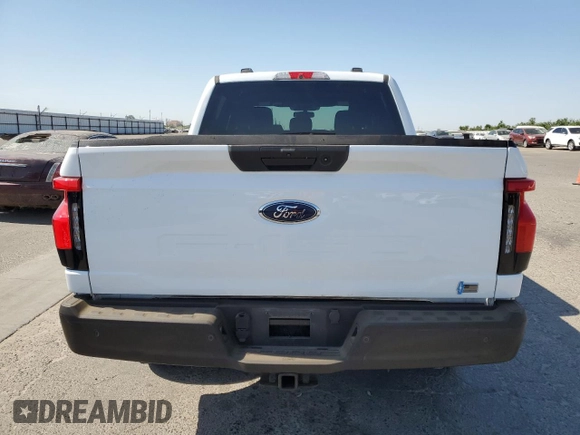 2023 Ford F-150 Lightning Pro with VIN 1FT6W1EVXPWG44972, listed as a Copart auction lot 60303485 with 19,788 mi miles and Salvage title. Bid and sale history available at DreamBid. Image 6.