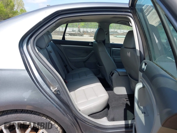 2008 Volkswagen Jetta Sedan Wolfsburg with VIN 3VWRJ71K58M185147, listed as a IAAI auction lot 42076387 with 193,621 mi miles. Bid and sale history available at carsss.com. Image 8.