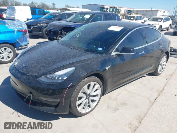 2020 Tesla Model 3 Standard Range Plus with VIN 5YJ3E1EAXLF614002, listed as a IAAI auction lot 41758898 with 42,363 mi miles and . Bid and sale history available at DreamBid. Image 2.