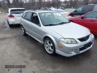 2002 Mazda Protege with VIN JM1BJ246221563595, listed as a IAAI auction lot 41796425 with 184,103 mi miles and . Bid and sale history available at DreamBid. Image 1.