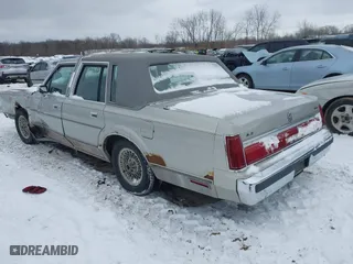 1986 Lincoln Town Car with VIN 1LNBP96F6GY618970, listed as a IAAI auction lot 41609991 with 22,768 mi miles. Bid and sale history available at carsss.com. Image 3.