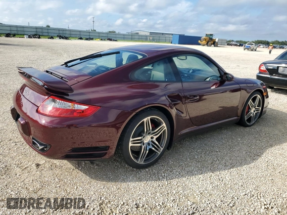 2007 Porsche 911 Turbo z VIN WP0AD29977S785167, wystawiony jako Copart lot #73803074 z przebiegiem 18 960 mil mil oraz Szkoda całkowita • Salvage title. Historia ofert i sprzedaży dostępna na DreamBid. Obrazek 3.