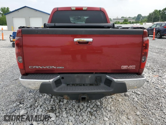 2010 GMC Canyon SLE1 with VIN 1GTJTCDE4A8143006, listed as a Copart auction lot 60853175 with 148,457 mi miles and Salvage title. Bid and sale history available at DreamBid. Image 6.