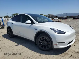 2023 Tesla Model Y Long Range z VIN 7SAYGDEE2PA061792, wystawiony jako Copart lot #52106965 z przebiegiem 11 968 mil mil oraz Szkoda całkowita • Salvage title. Historia ofert i sprzedaży dostępna na DreamBid. Obrazek 4.