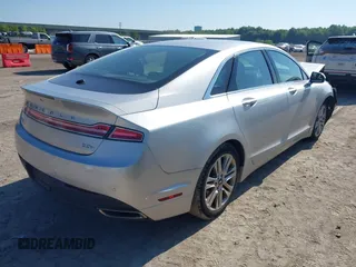 2014 Lincoln MKZ Hybrid with VIN 3LN6L2LU5ER822663, listed as a IAAI auction lot 42656735 with 122,025 mi miles and . Bid and sale history available at DreamBid. Image 4.