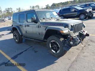 2020 Jeep Wrangler Unlimited Rubicon with VIN 1C4HJXFN4LW136516, listed as a IAAI auction lot 41874403 with 87,576 mi miles. Bid and sale history available at carsss.com. Image 1.