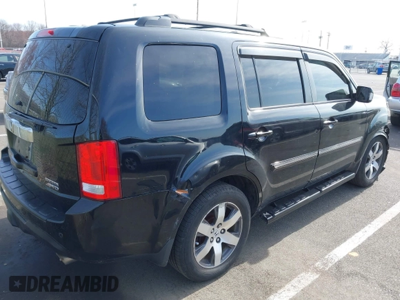 2012 Honda Pilot Touring with VIN 5FNYF4H96CB041380, listed as a IAAI auction lot 41941615 with 137,537 mi miles and . Bid and sale history available at DreamBid. Image 4.