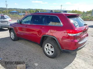 2014 Jeep Grand Cherokee Laredo with VIN 1C4RJFAG8EC262292, listed as a IAAI auction lot 40568162 with 124,871 mi miles and . Bid and sale history available at DreamBid. Image 3.