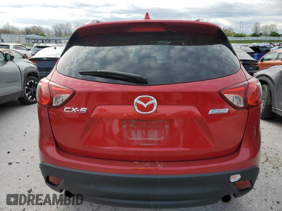 2014 Mazda CX-5 Touring with VIN JM3KE2CY6E0316041, listed as a Copart auction lot 52227835 with 69,921 mi miles and Salvage Title. Bid and sale history available at DreamBid. Image 6.