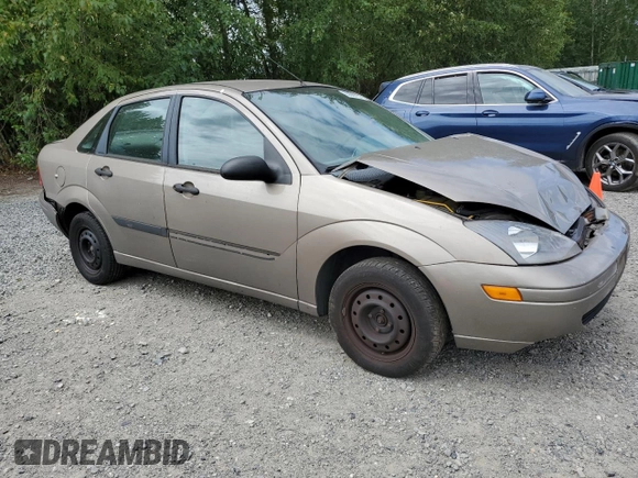 2004 Ford Focus LX with VIN 1FAFP33P24W148563, listed as a Copart auction lot 63869755 with 142,243 mi miles and Salvage title. Bid and sale history available at DreamBid. Image 4.