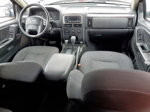 2003 Jeep Grand Cherokee Laredo with VIN 1J4GW48SX3C569087, listed as a Copart auction lot 55941035 with Not provided miles and Salvage title. Bid and sale history available at DreamBid. Image 8.