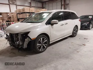 2018 Honda Odyssey Elite with VIN 5FNRL6H94JB034739, listed as a IAAI auction lot 41242506 with 96,982 mi miles and . Bid and sale history available at DreamBid. Image 2.