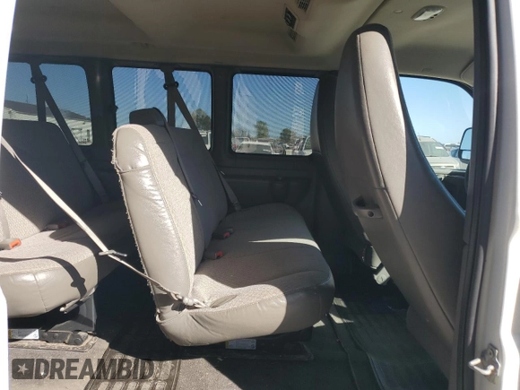 2013 Chevrolet Express Passenger 1LT z VIN 1GAZGYFG5D1190358, wystawiony jako Copart lot #75496574 z przebiegiem 114 340 mil mil oraz Szkoda całkowita • Salvage title. Historia ofert i sprzedaży dostępna na DreamBid. Obrazek 11.