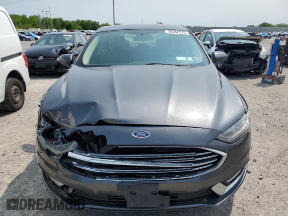 2017 Ford Fusion SE z VIN 3FA6P0H74HR390898, wystawiony jako Copart lot #58958275 z przebiegiem 159 799 mil mil oraz Szkoda całkowita • Salvage title. Historia ofert i sprzedaży dostępna na DreamBid. Obrazek 5.