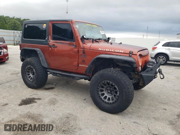 2014 Jeep Wrangler Rubicon with VIN 1C4BJWCG2EL303420, listed as a Copart auction lot 63550985 with 87,175 mi miles and Salvage title. Bid and sale history available at DreamBid. Image 4.